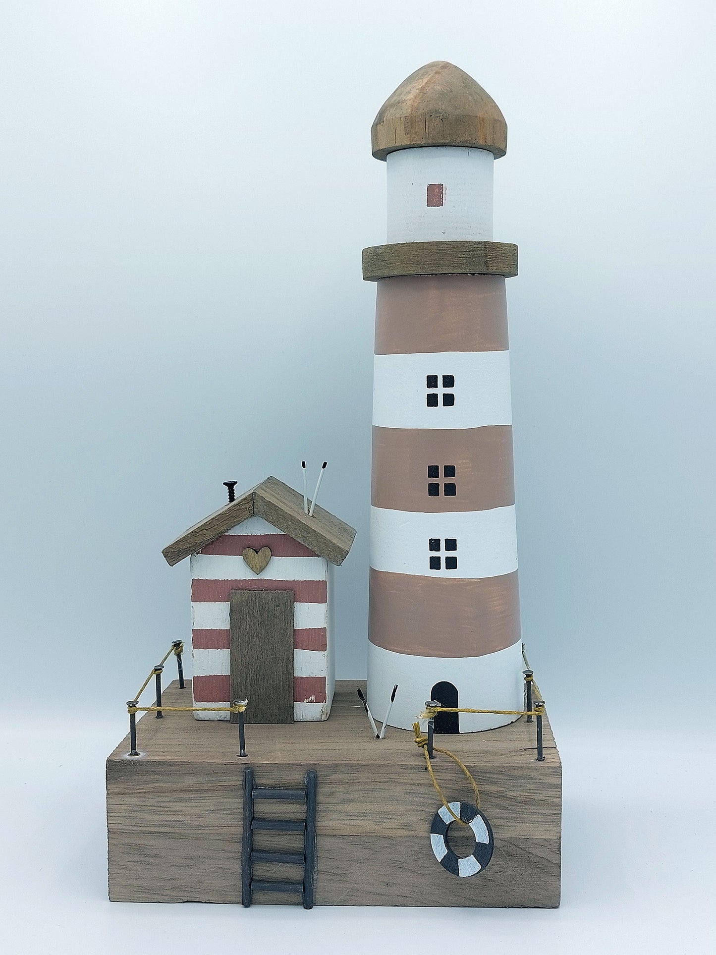 Lighthouse and Beach Hut Scene