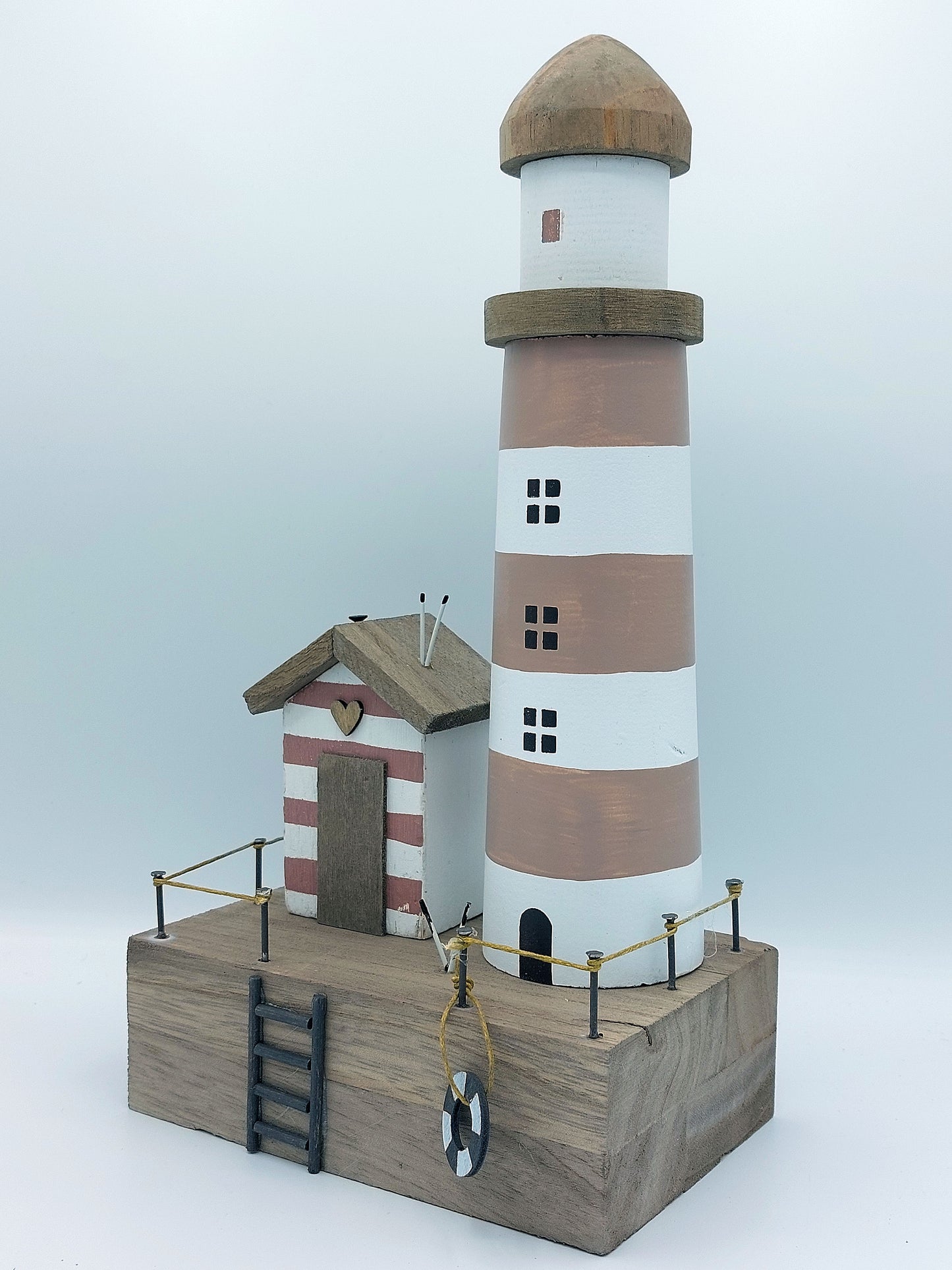 Lighthouse and Beach Hut Scene