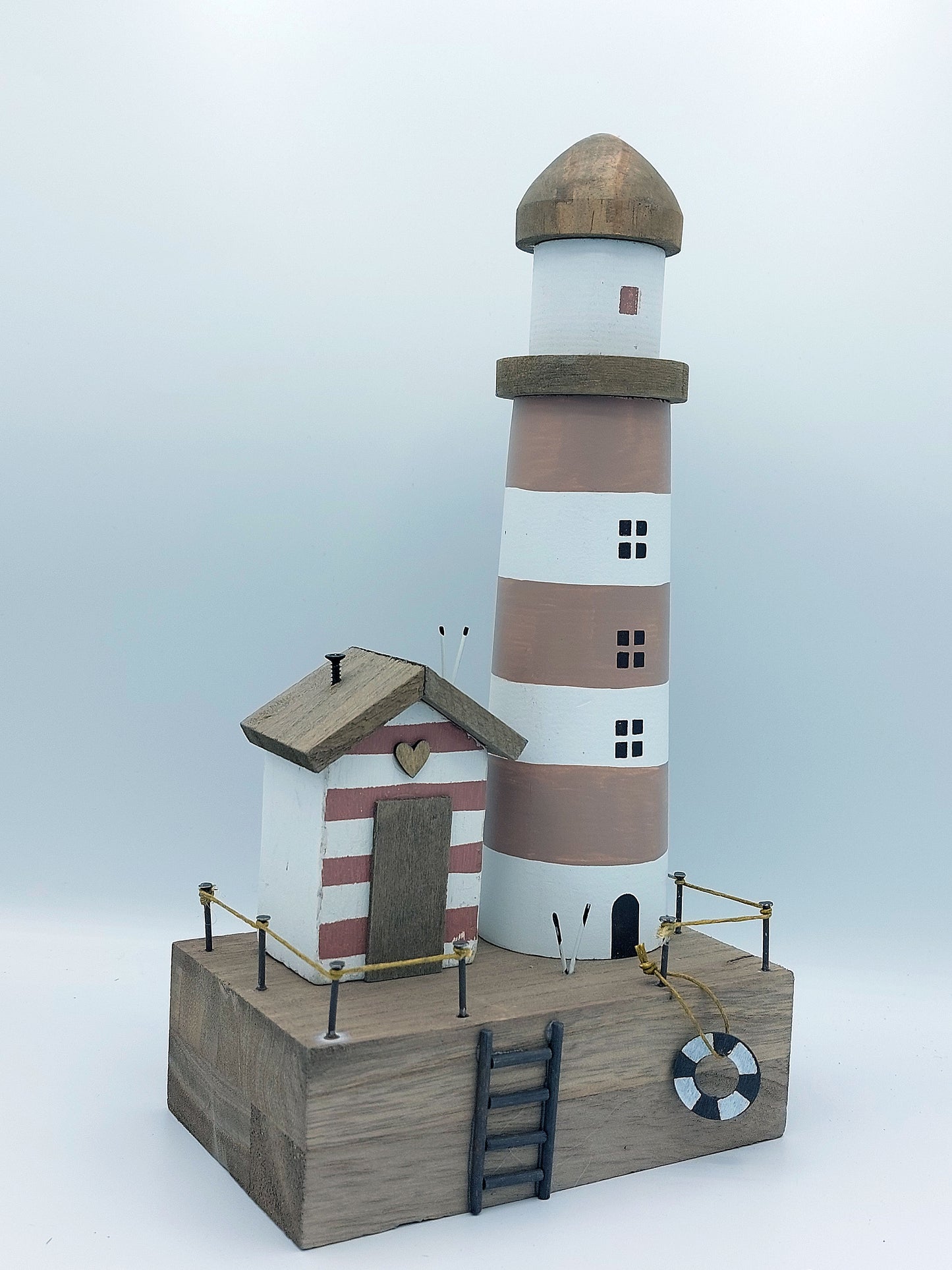 Lighthouse and Beach Hut Scene