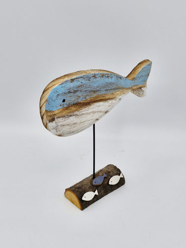 wooden whale with fish