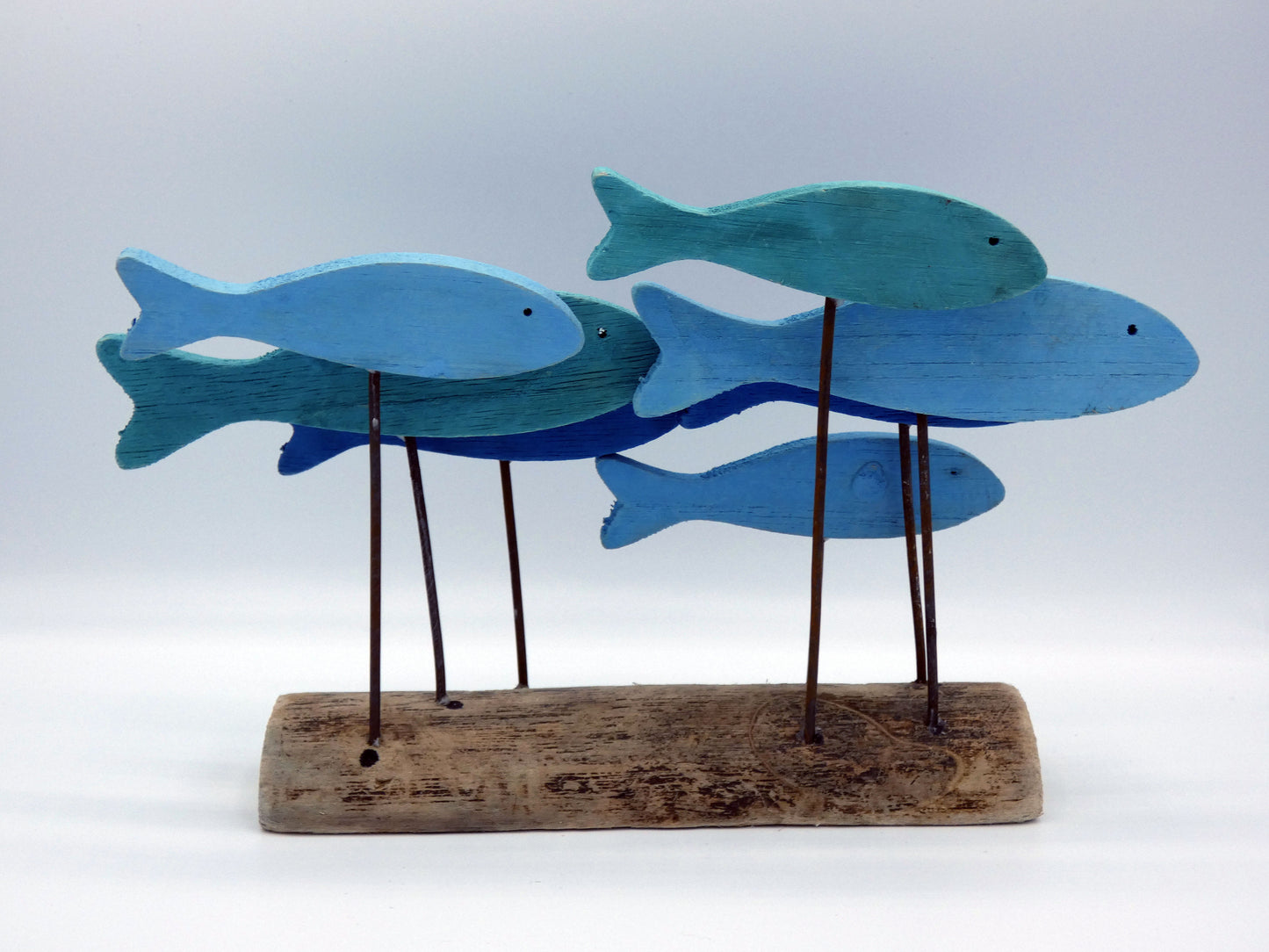 Blue and Green Wooden School Of Fish