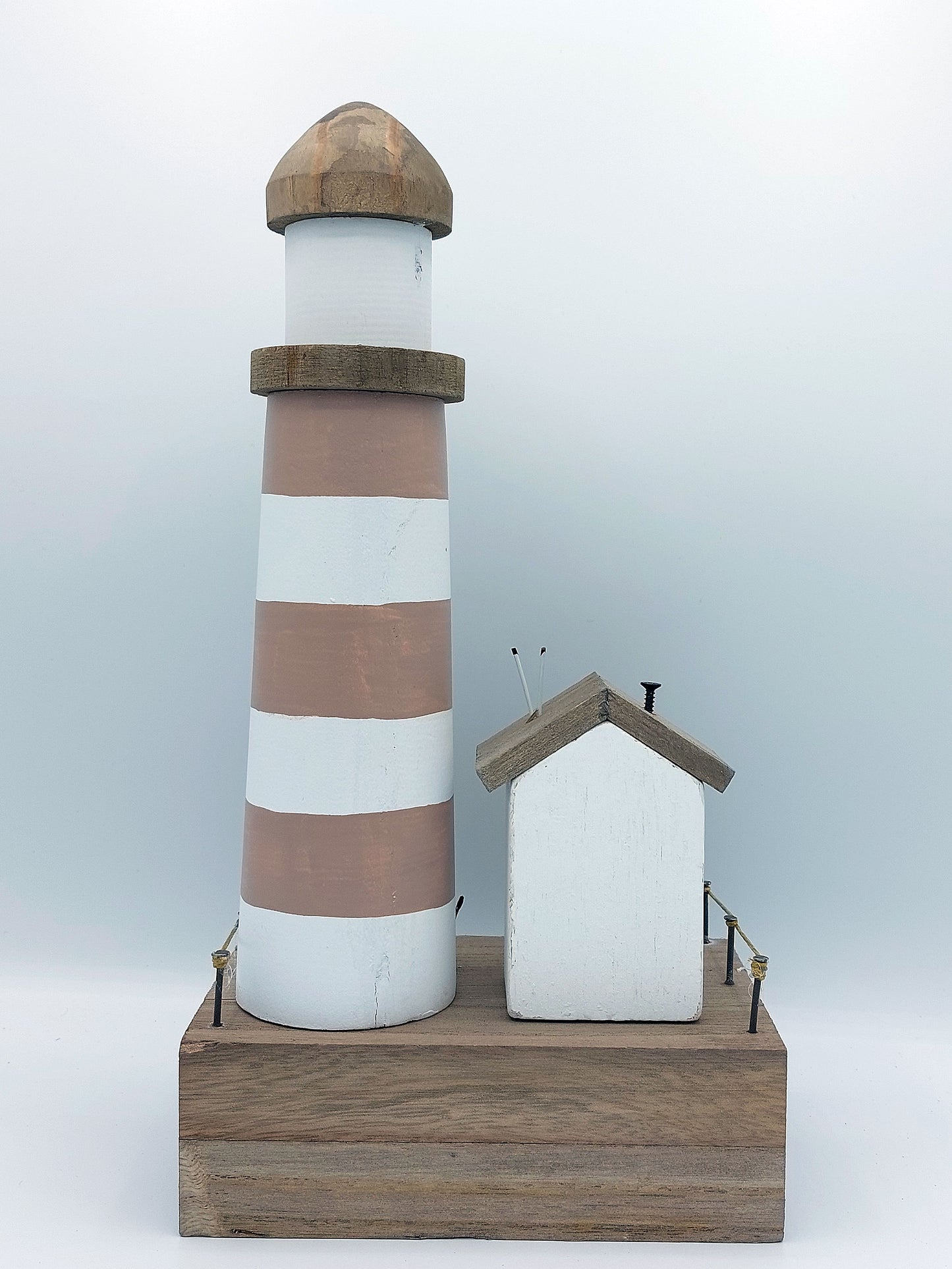 Lighthouse and Beach Hut Scene
