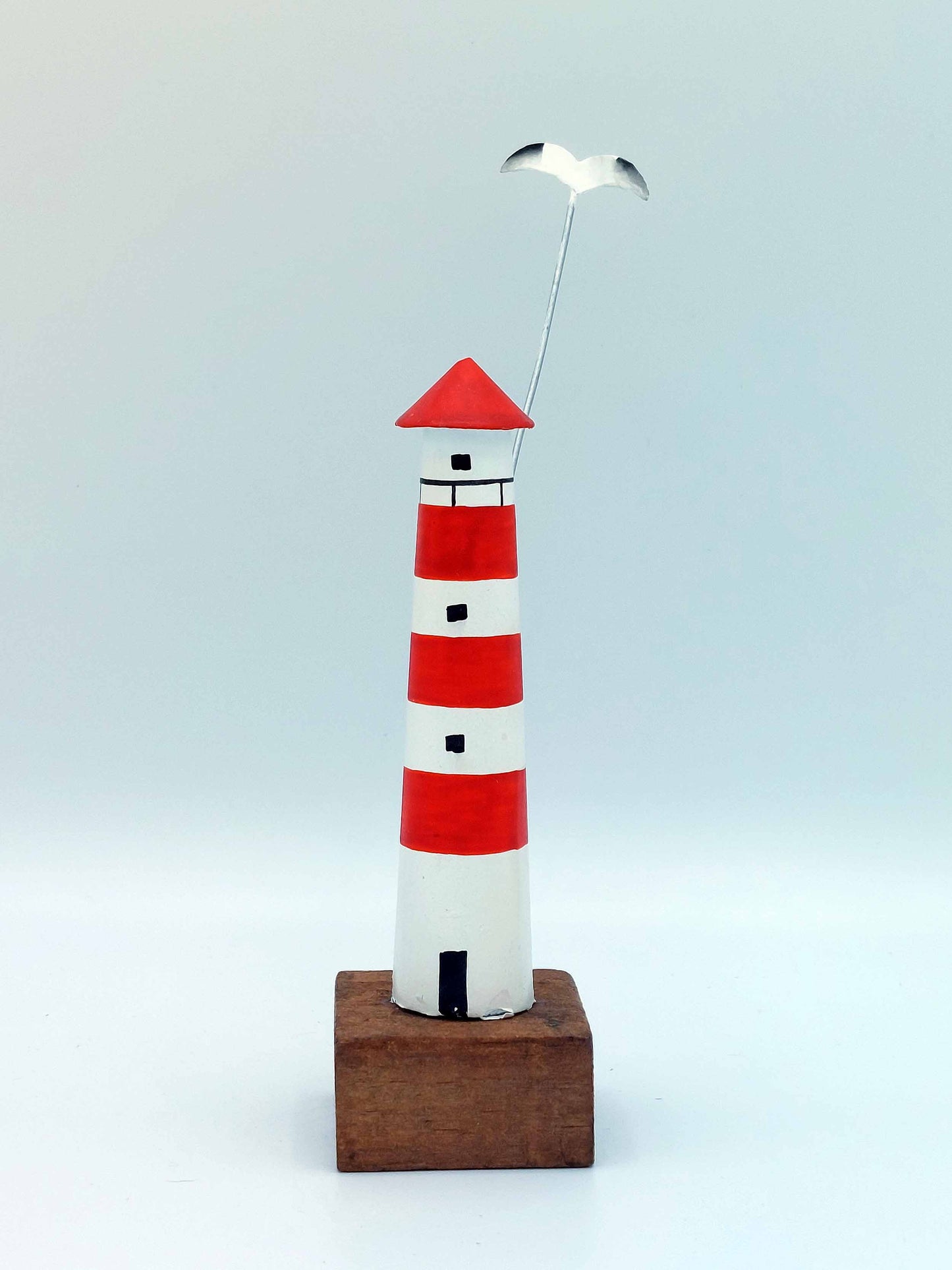 Small Red Lighthouse With Seagull