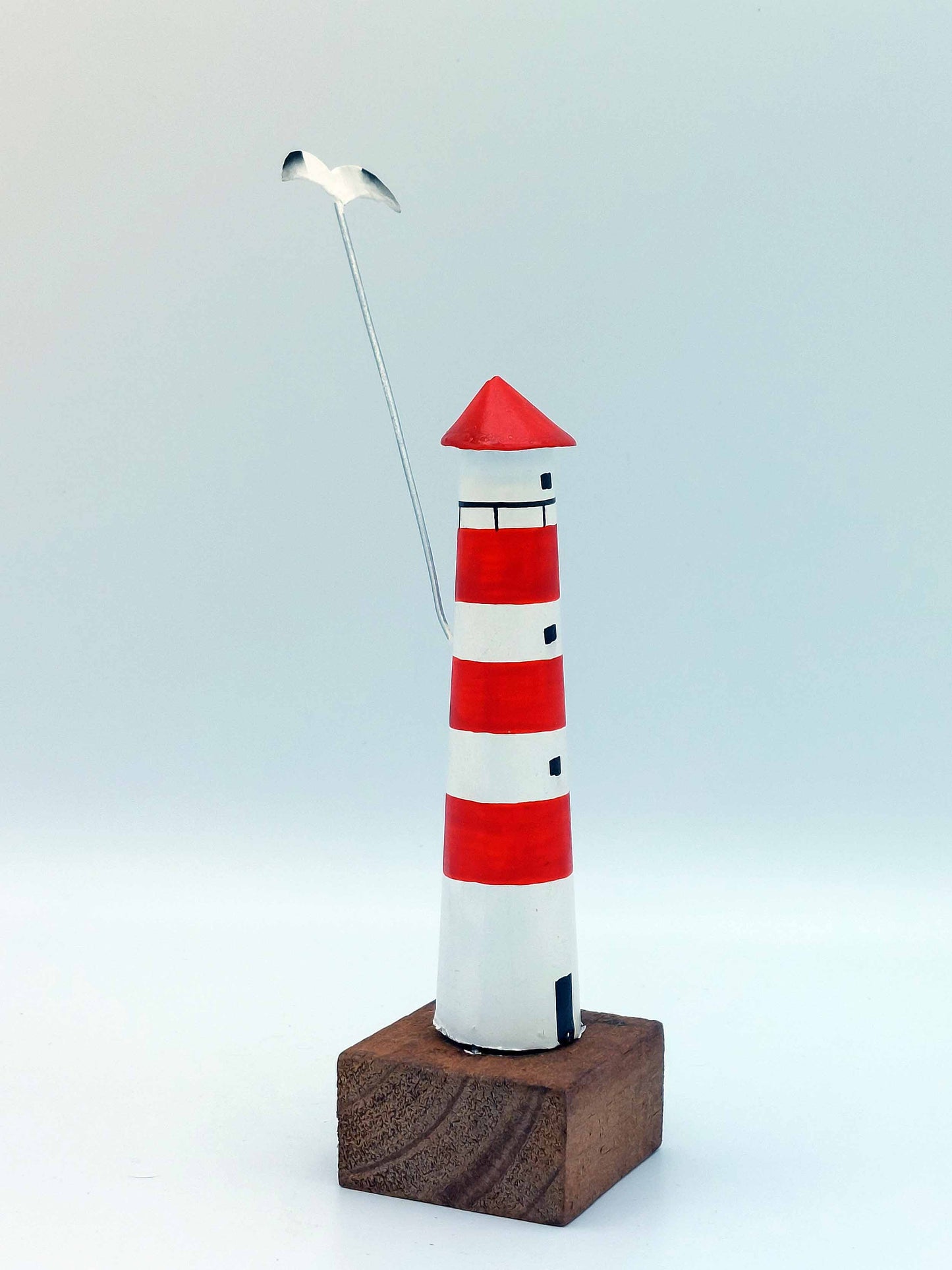 Small Red Lighthouse With Seagull