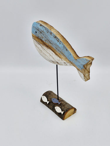 wooden whale with fish