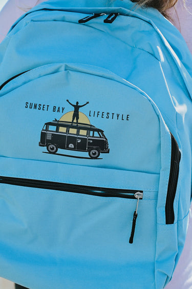 Backpack/Rucksack In Light Blue - Retro Campervan At Sunset Logo